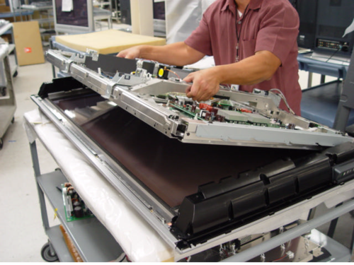 Technician replacing an LED screen